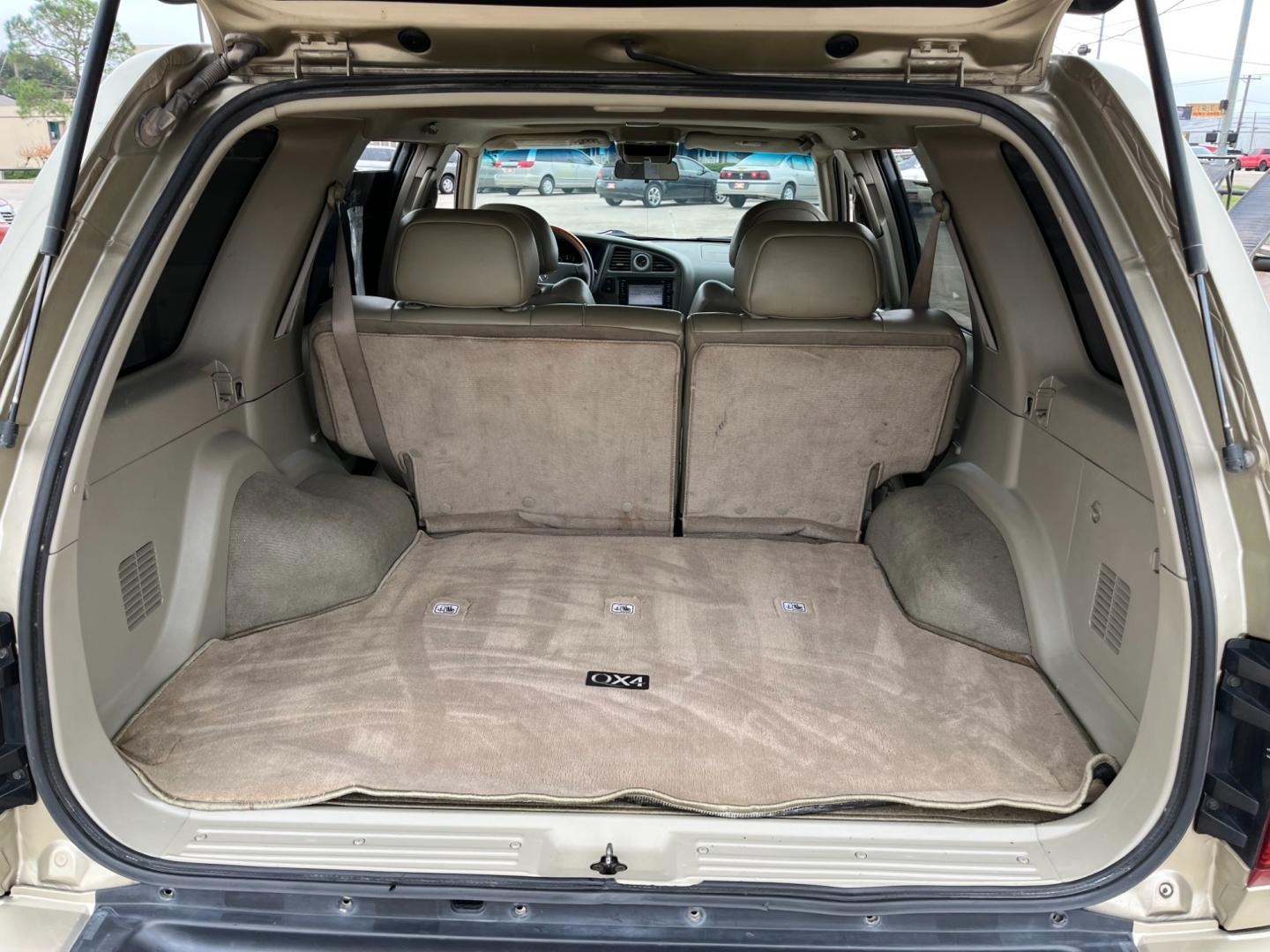 2003 tan /TAN Infiniti QX4 4WD (JNRDR09Y53W) with an 5 engine, 4-Speed Automatic Overdrive transmission, located at 14700 Tomball Parkway 249, Houston, TX, 77086, (281) 444-2200, 29.928619, -95.504074 - Photo#13